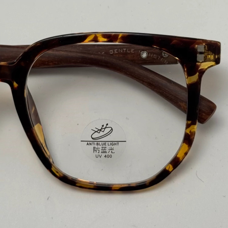 تصویر فریم عینک بلوکات طبی جنتل مانستر TR 8979 رنگ هاوانا به همراه کاور پارچه ای و دستمال