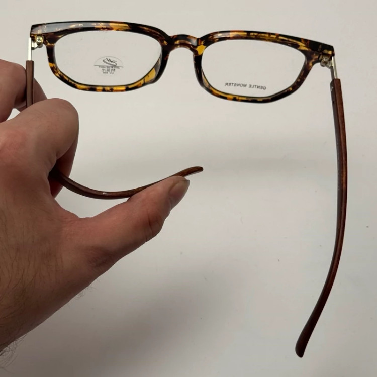 تصویر فریم عینک بلوکات طبی جنتل مانستر TR 8979 رنگ هاوانا به همراه کاور پارچه ای و دستمال