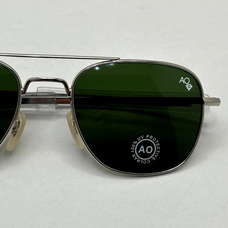 تصویر عینک آفتابی شیشه سنگ آمریکن اوپتیکال فریم نقره ای عدسی سبز سایز 54 آنتی رفلکس با پک کامل و آچار مخصوص عینک