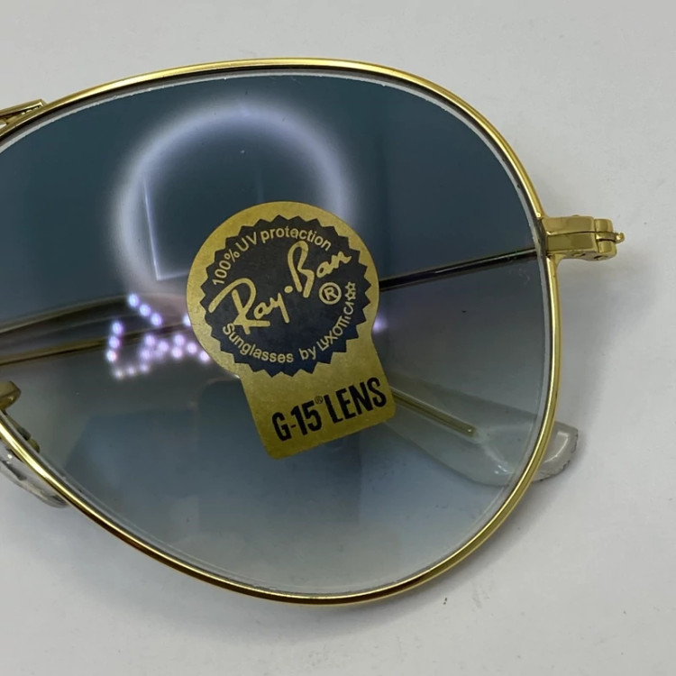 تصویر عینک ریبن خلبانی شیشه سنگ آبی با پک کامل اورجینال نشکن و زد خش ، زد اشعه ، زد زنگ