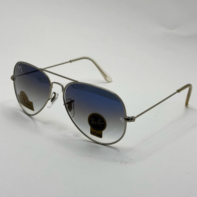 تصویر عینک ریبن خلبانی شیشه سنگ آبی هایلایت فریم نقره ای به همراه پک کامل ریبن Rayban RB 3025